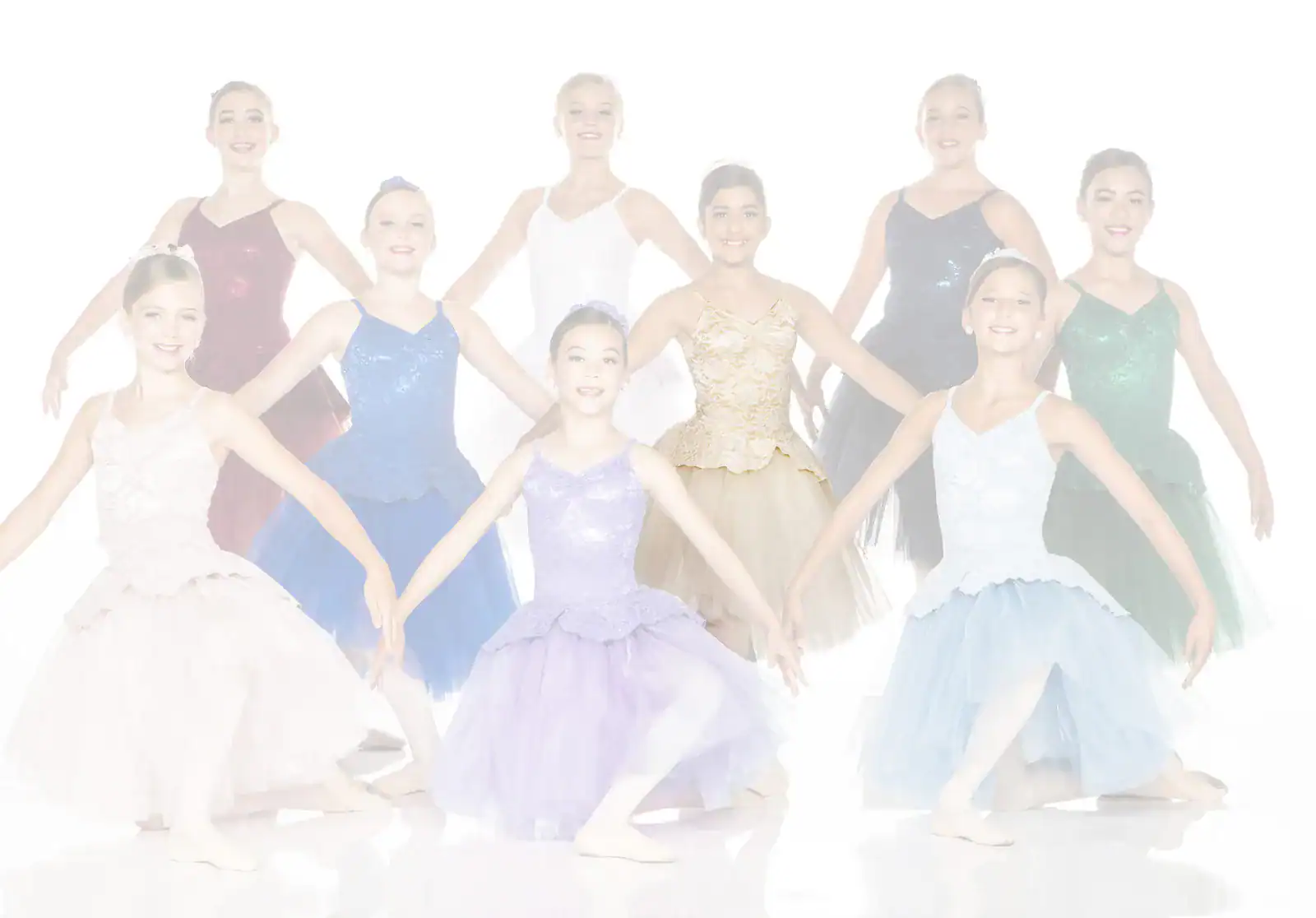 Young ballet dancers posing in colorful costumes