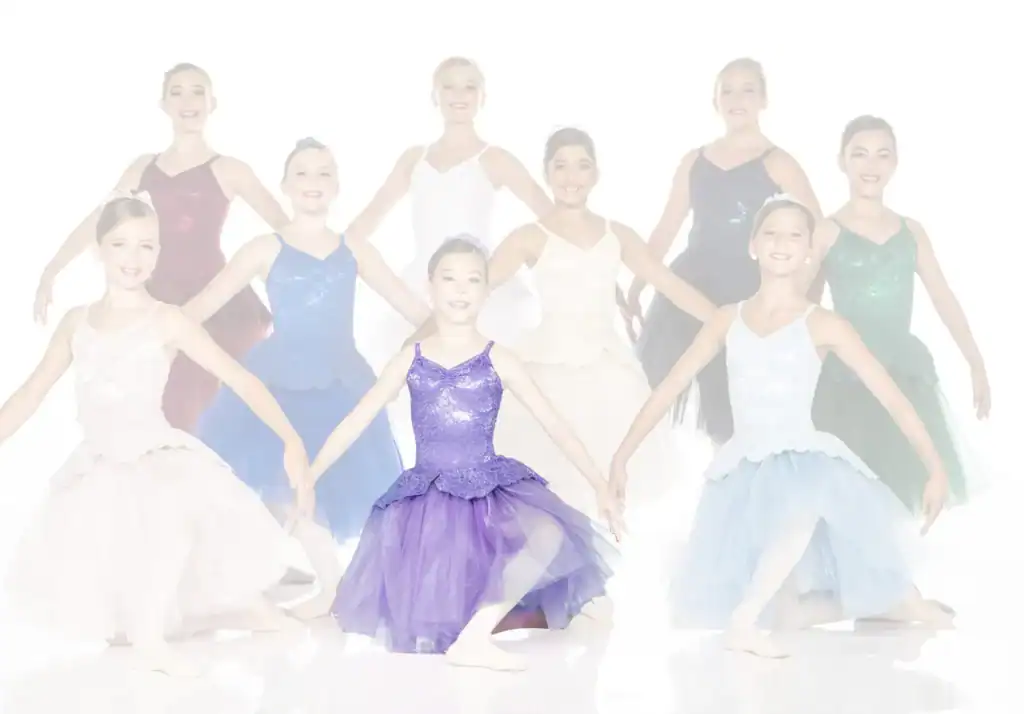 Young ballet dancers in colorful costumes posing together