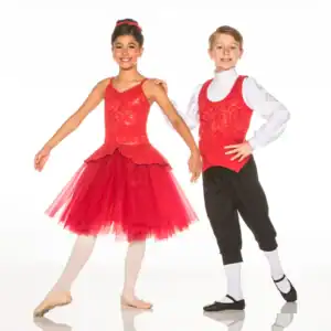Two young dancers in matching red costumes pose together.