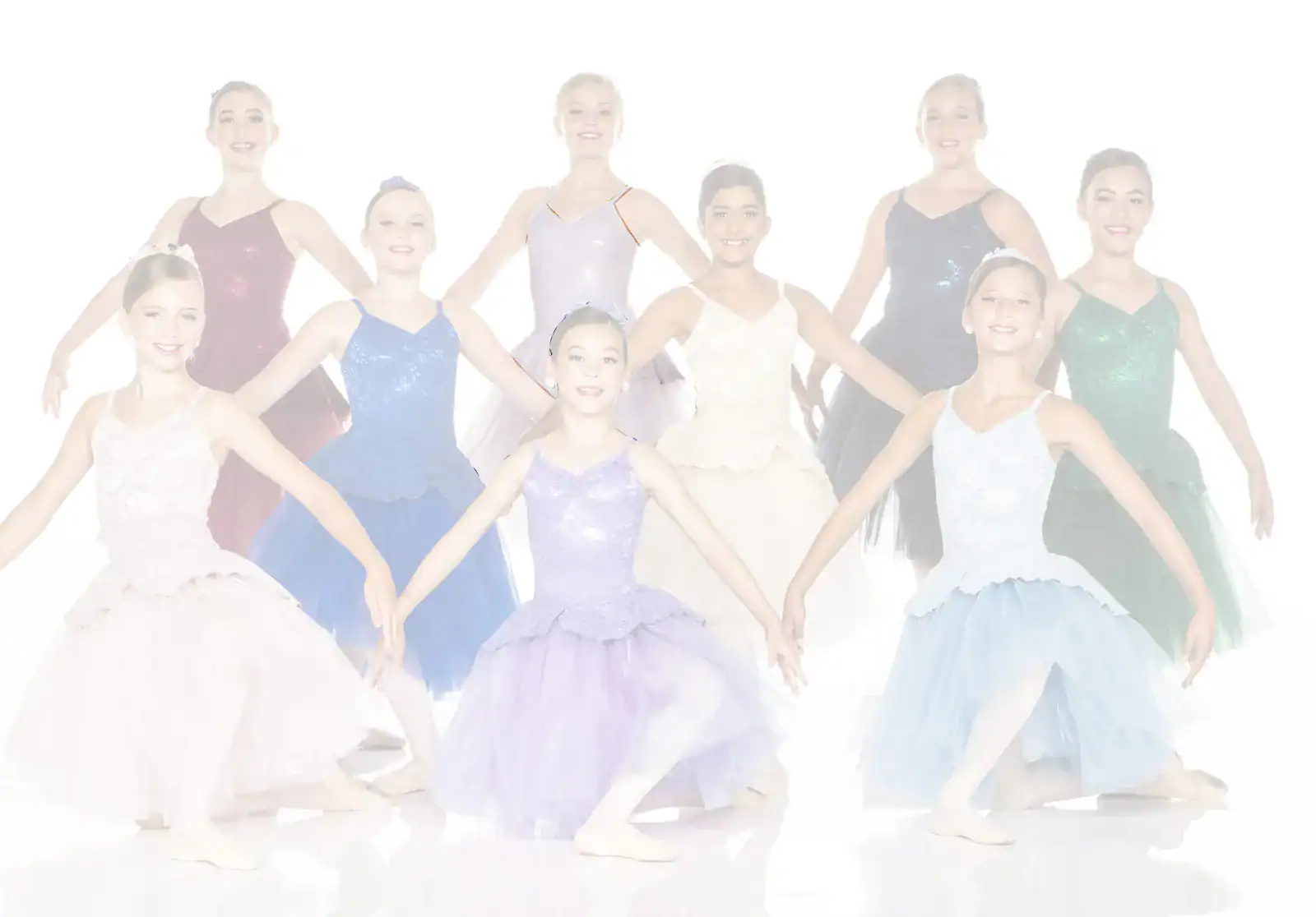 Young ballet dancers posing in colorful costumes