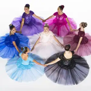 Seven dancers in colorful dresses hold hands in a circle.