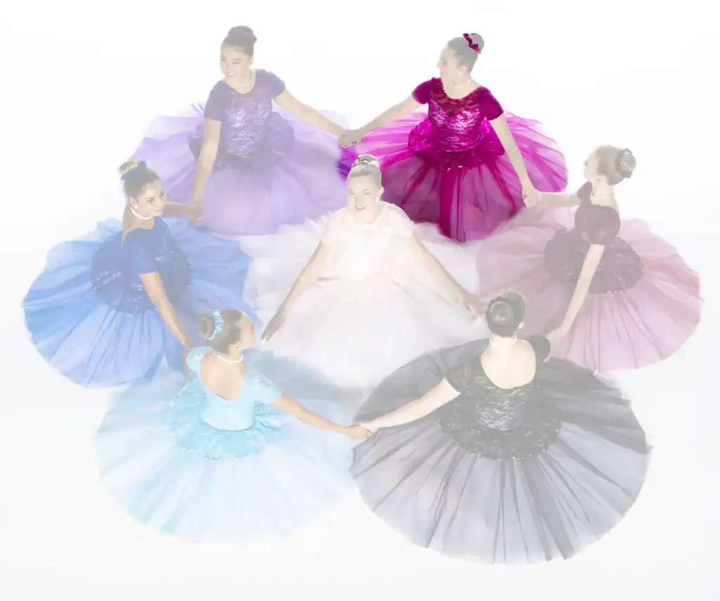 Seven dancers in colorful gowns hold hands in a circle.