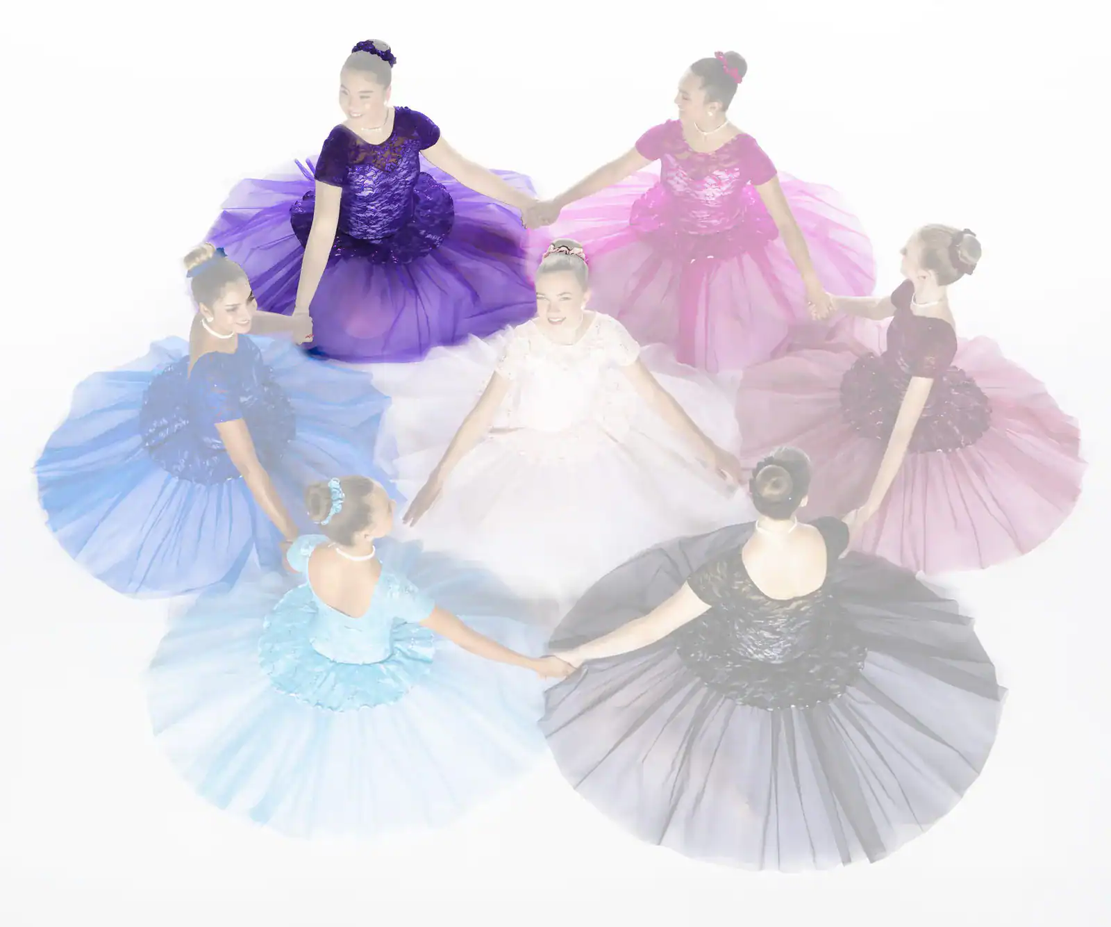 Seven dancers in colorful gowns hold hands in a circle.
