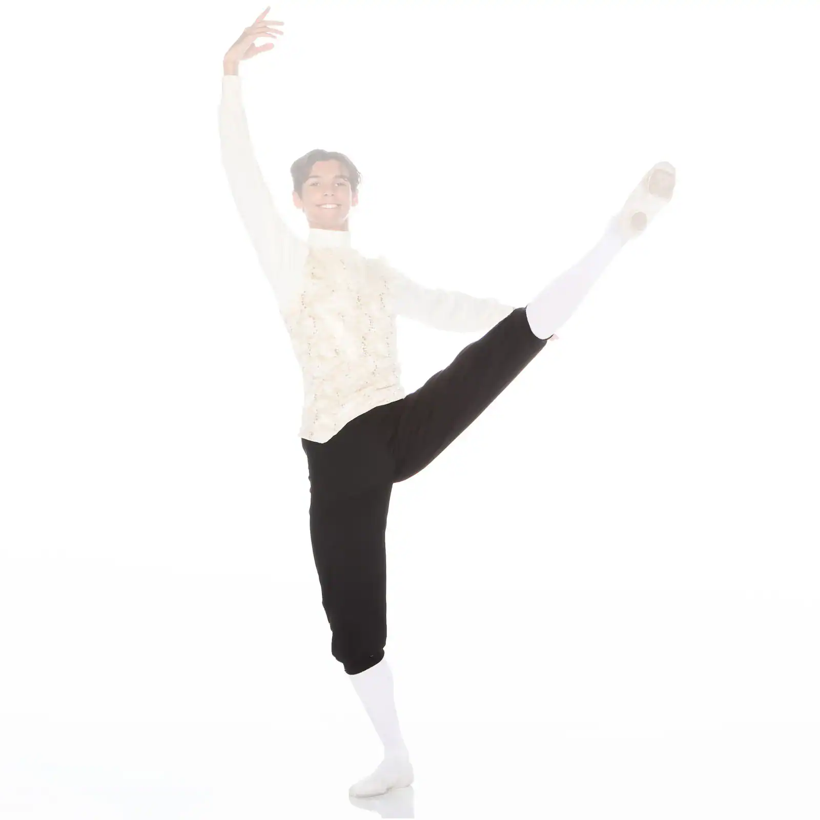 Male ballet dancer performing a high leg extension