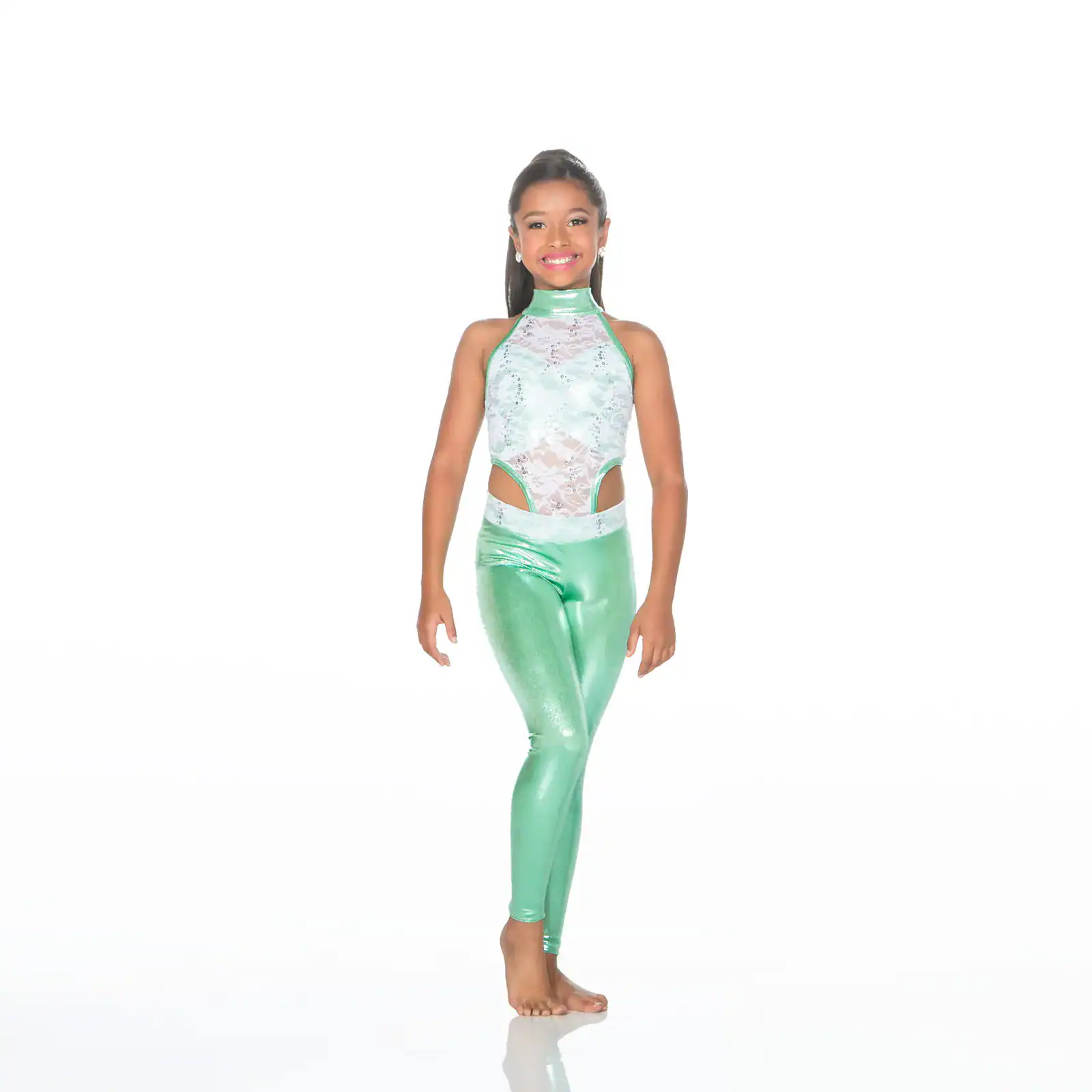 Young dancer wearing a mint green costume against white background