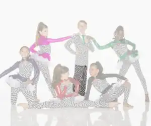 Six young dancers pose in colorful checkerboard costumes.