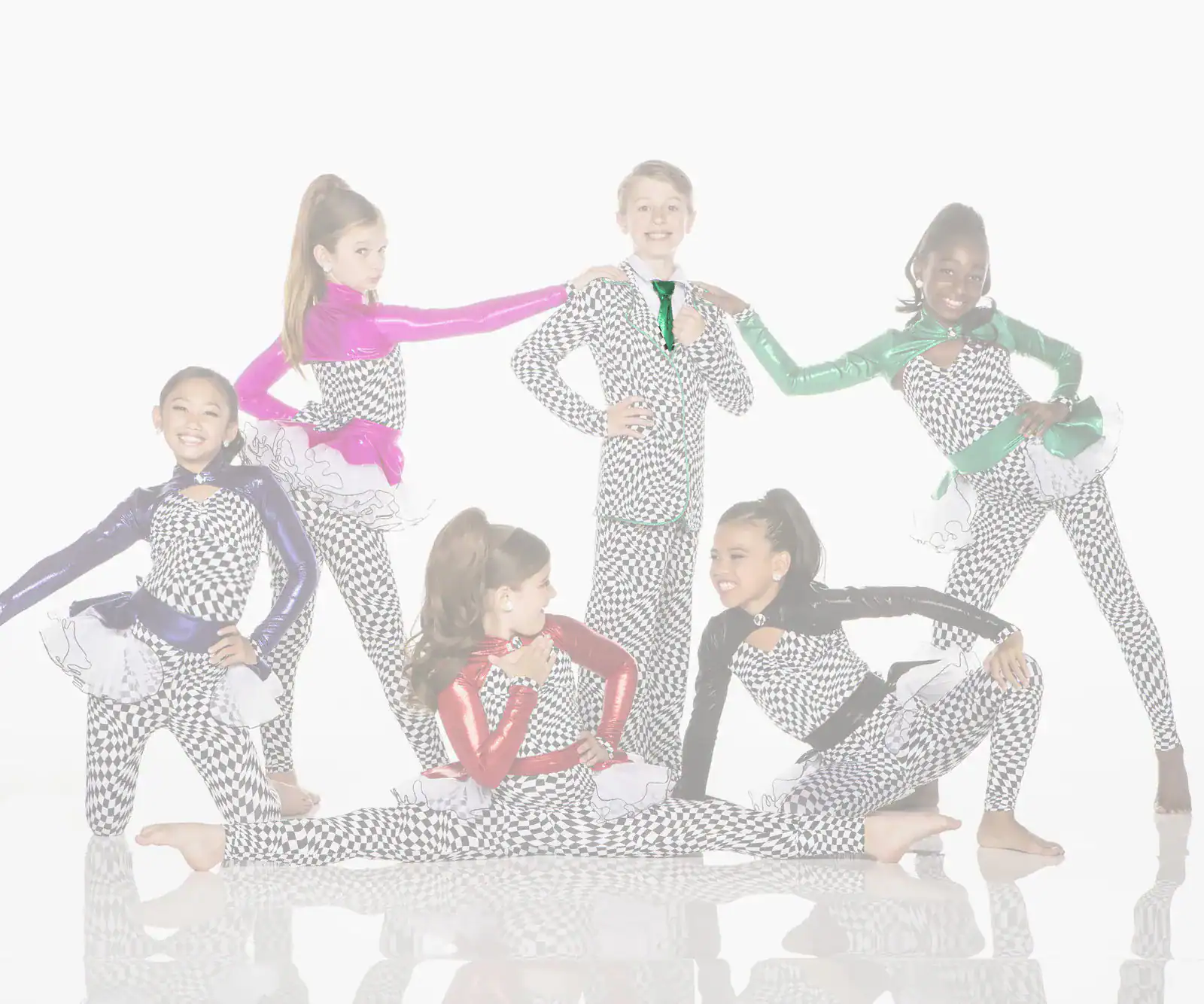 Young dancers in checkered costumes posing in colorful sleeves