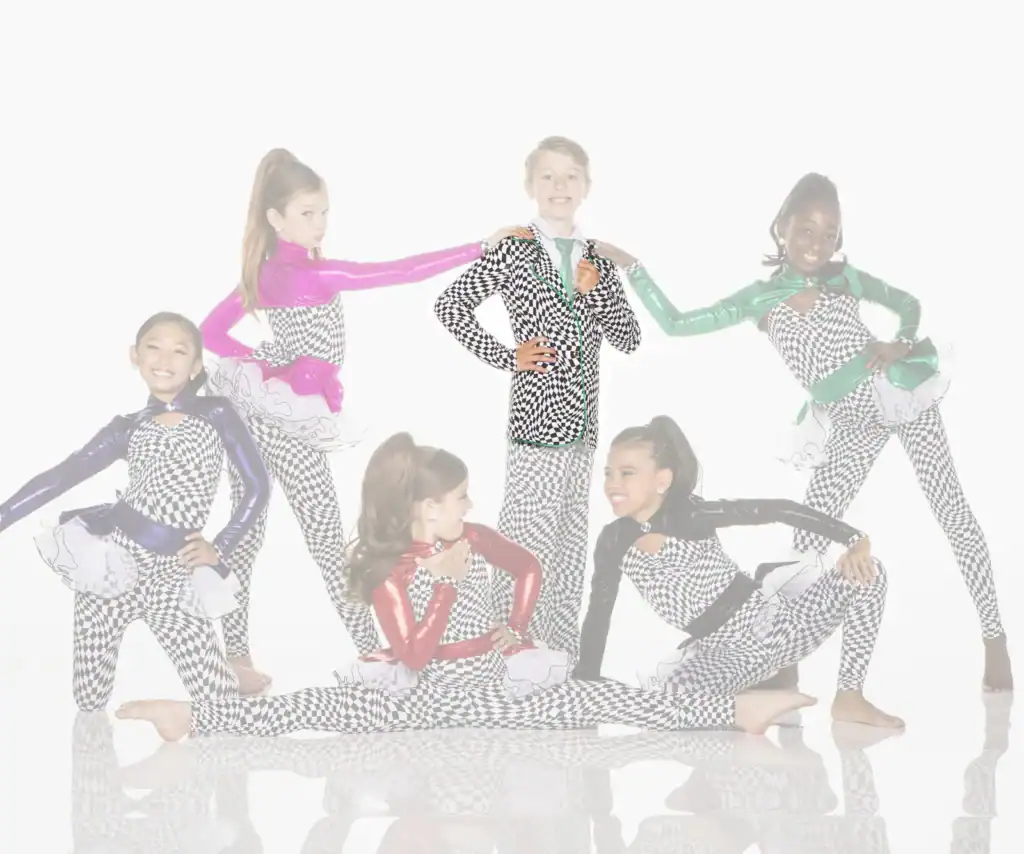 Six young dancers pose in colorful checkered costumes.