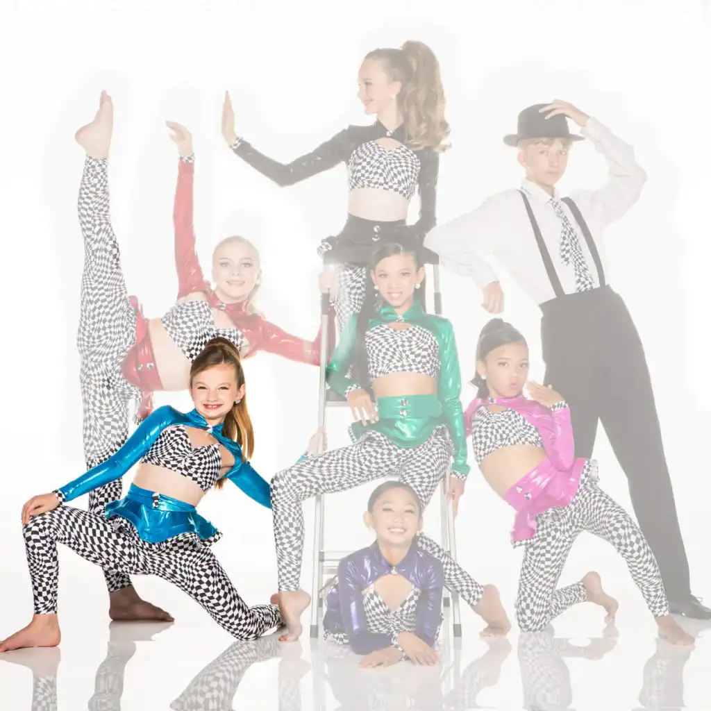 Youth dance team in colorful checkered costumes posing together