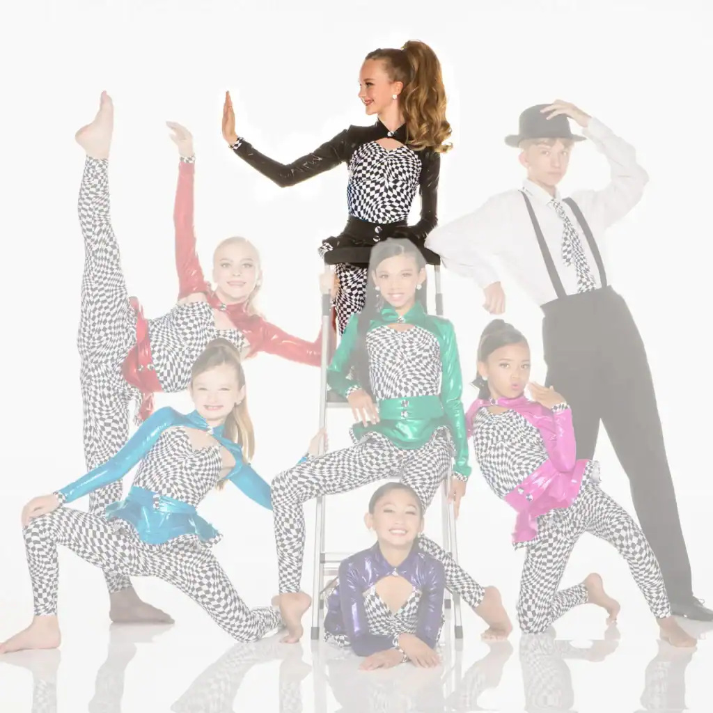 Youth dance team posing in colorful checkered costumes