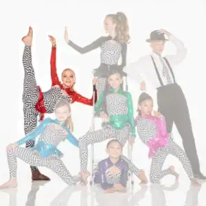 Young dance troupe posing in colorful checkered costumes