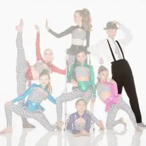 Young dancers pose in colorful checkered costumes with a male performer.