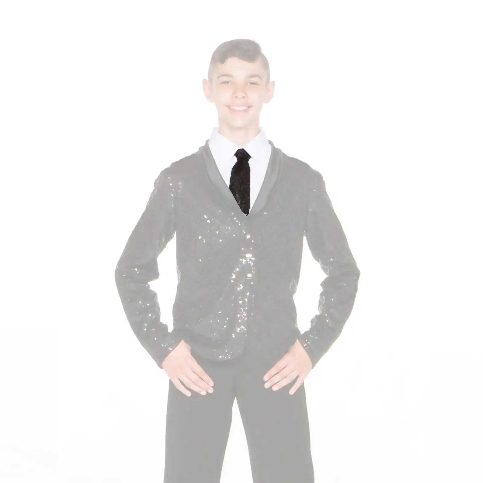 Smiling boy in sequined jacket, white shirt, and black tie