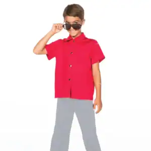 Smiling boy in red shirt adjusts sunglasses