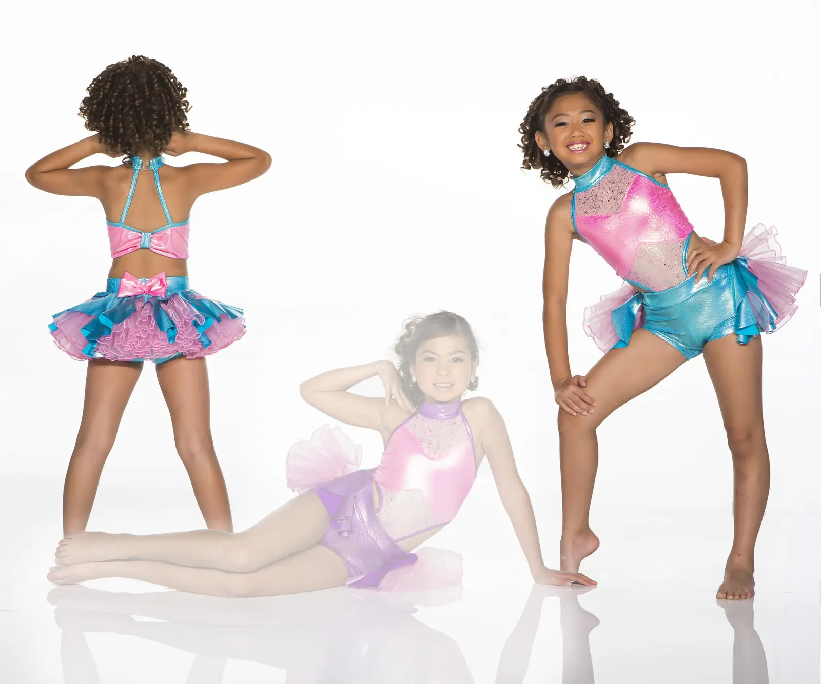 Girl modeling colorful pink and turquoise dance costume