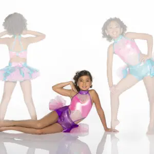Three girls model colorful dance costumes against a white background.