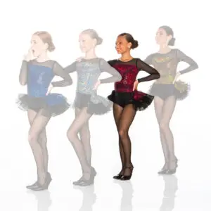 Four young dancers wearing glittery costumes pose together.