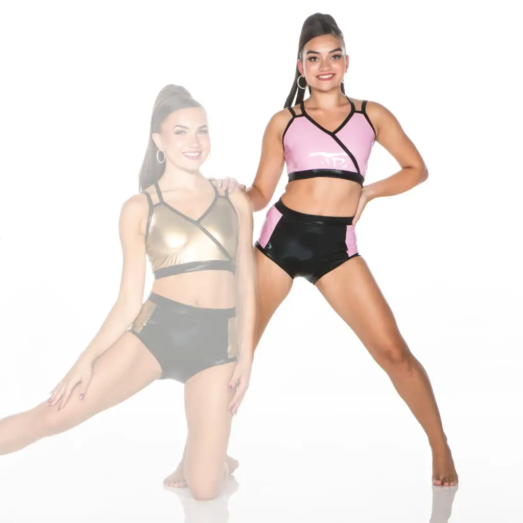 Two women model shiny pink and gold dancewear sets.