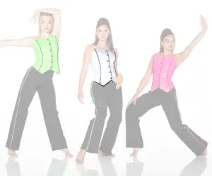 Three women pose in colorful vests and black pants.