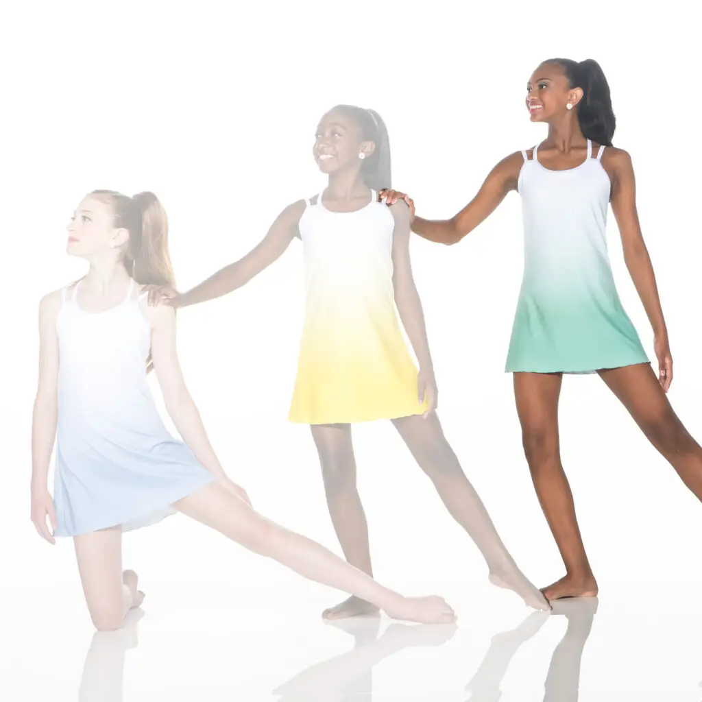 Three dancers wearing pastel dresses pose against a white background.
