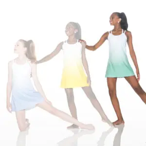 Three dancers wearing pastel dresses pose against a white background.