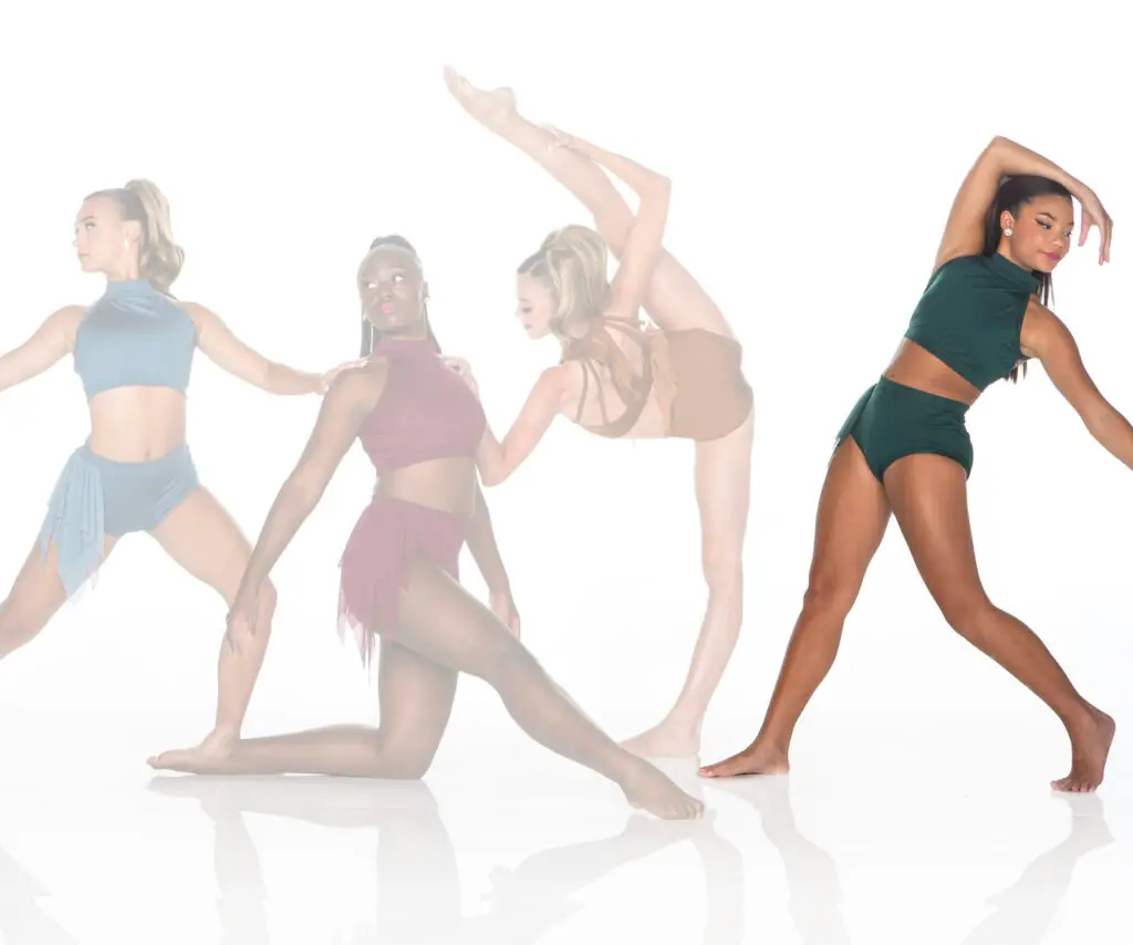 Four female dancers posing in colorful costumes on white background