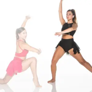 Two dancers in black and pink costumes posing