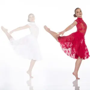 Dancer in red lace dress performing a graceful pose
