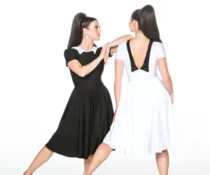 Two women modeling black and white dresses