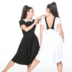 Two women modeling black and white dresses