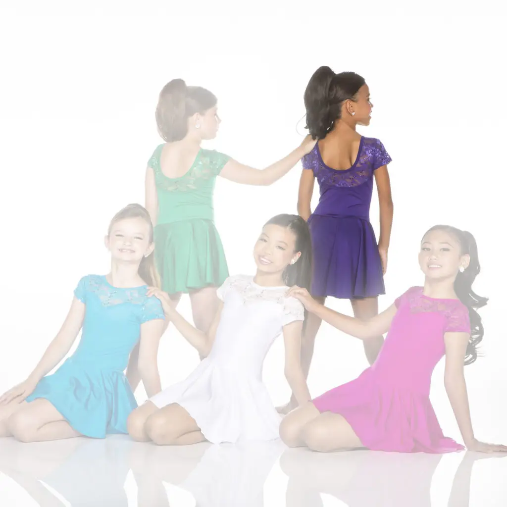 Five young dancers in colorful dresses posing together