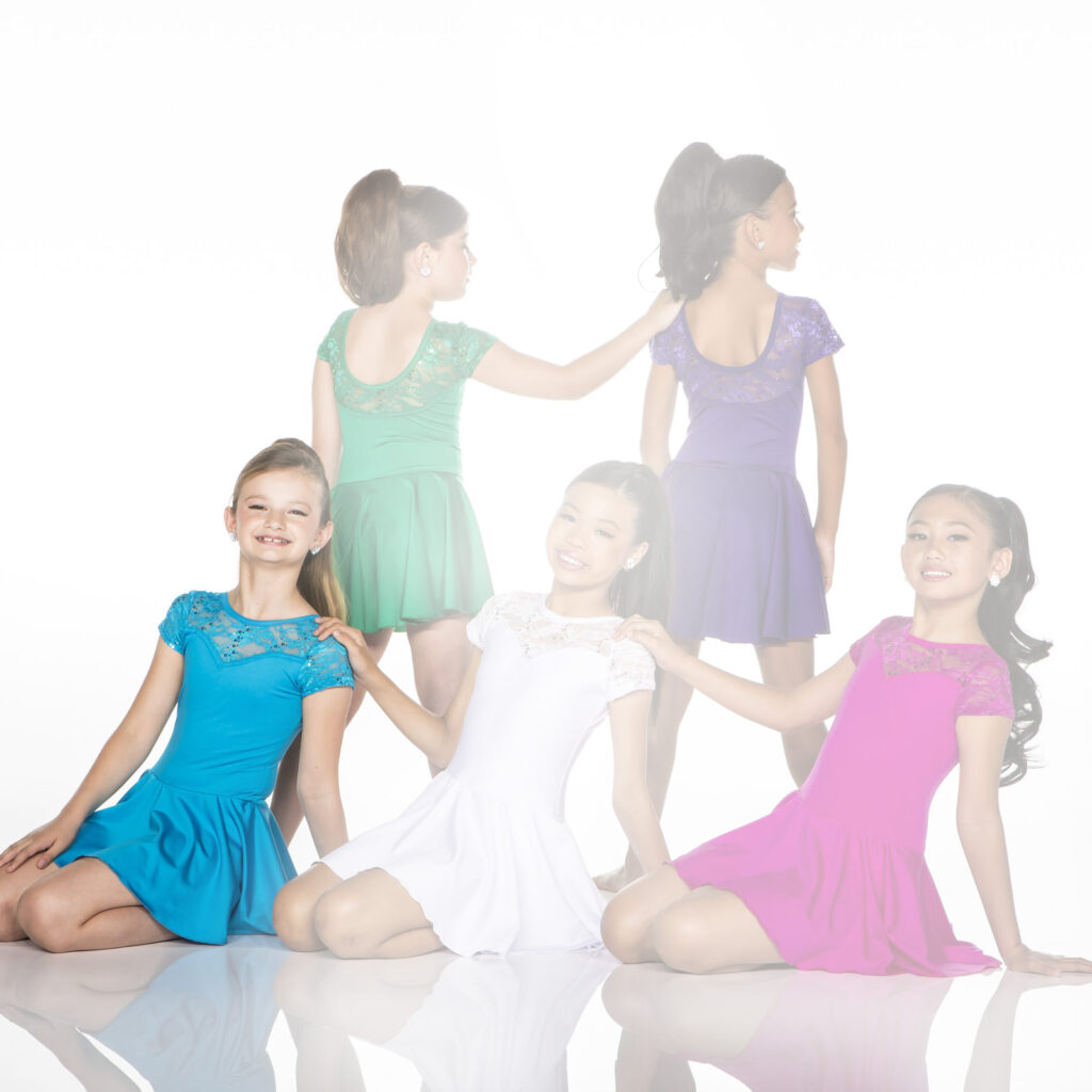 Five girls wearing colorful dresses pose against white background.