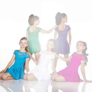 Five girls wearing colorful dresses pose against white background.