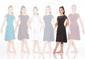 Six young women modeling lace dresses in various colors