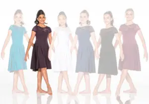 Six girls modeling lace-top dresses in assorted colors