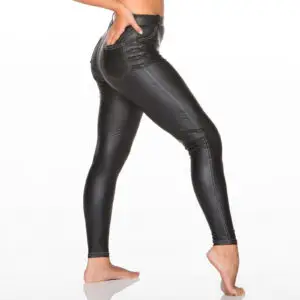 Model wearing black faux leather leggings with contrast stitching