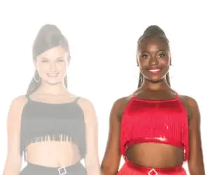 Two smiling women in black and red fringe dance outfits