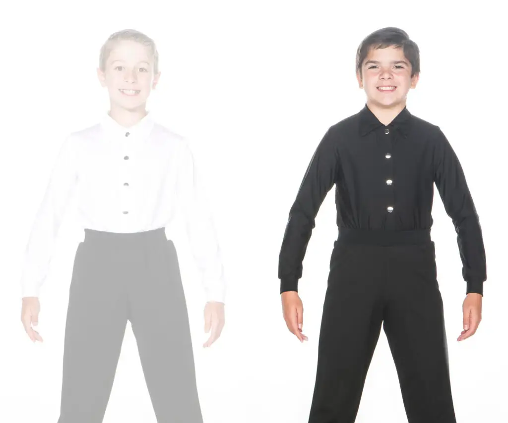 Smiling boy modeling a black button-up shirt and pants
