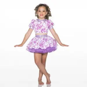 Smiling girl wearing purple floral dance costume