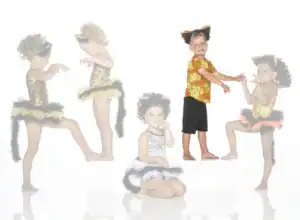 Children wearing animal costumes pose against a white background.