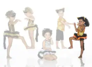 Five children wearing animal-themed costumes and posing playfully