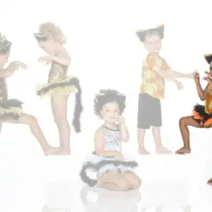 Five children wearing animal-themed costumes and posing playfully