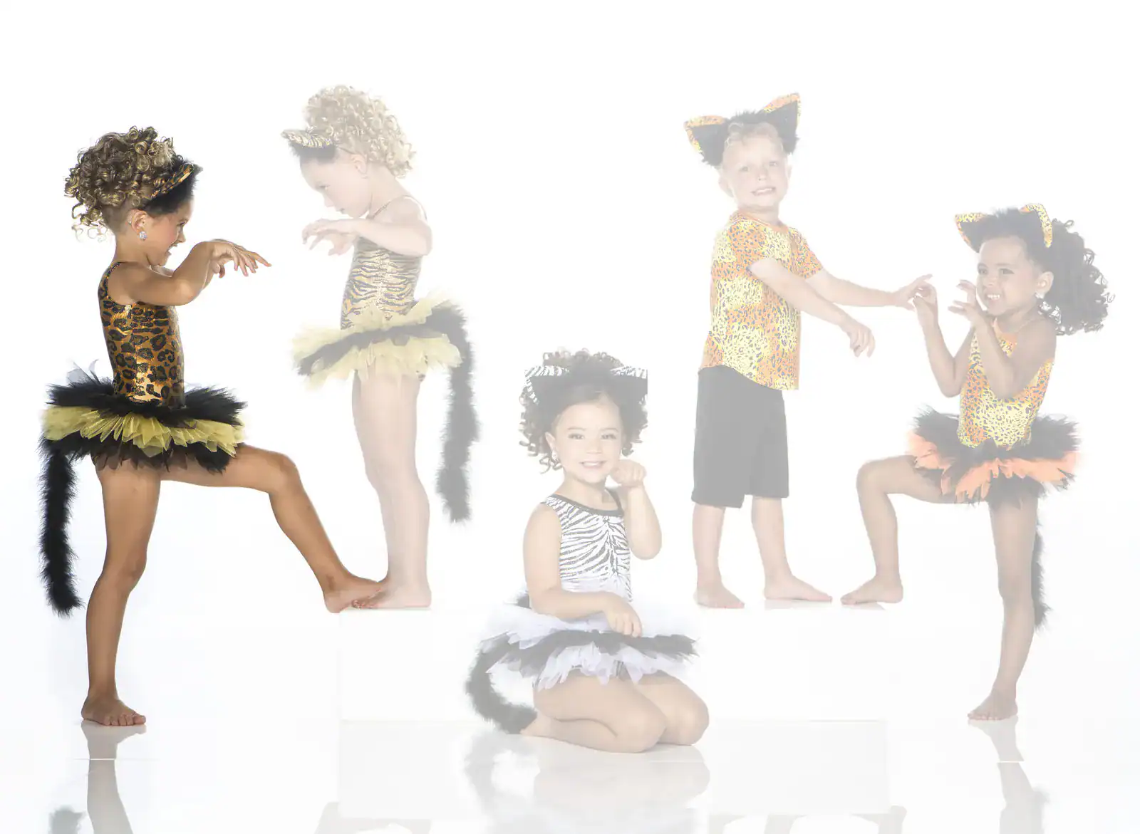 Five children in leopard and zebra animal costumes
