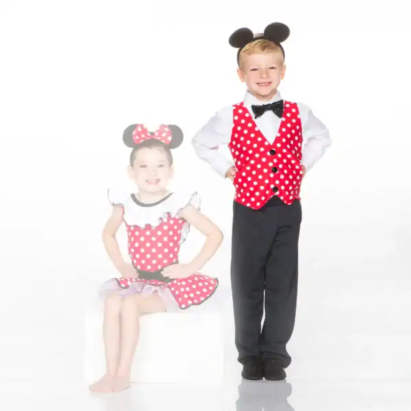 Two children wearing red polka-dot mouse costumes