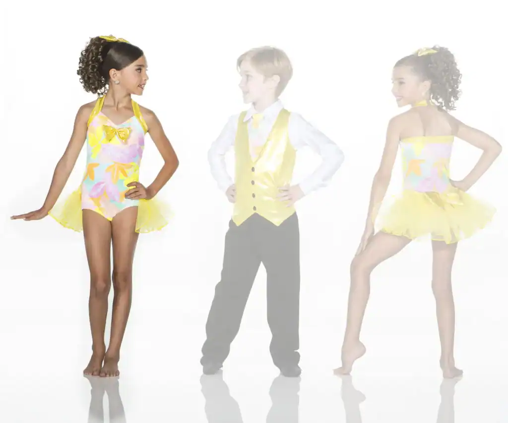 Children modeling colorful dance costumes against a white background