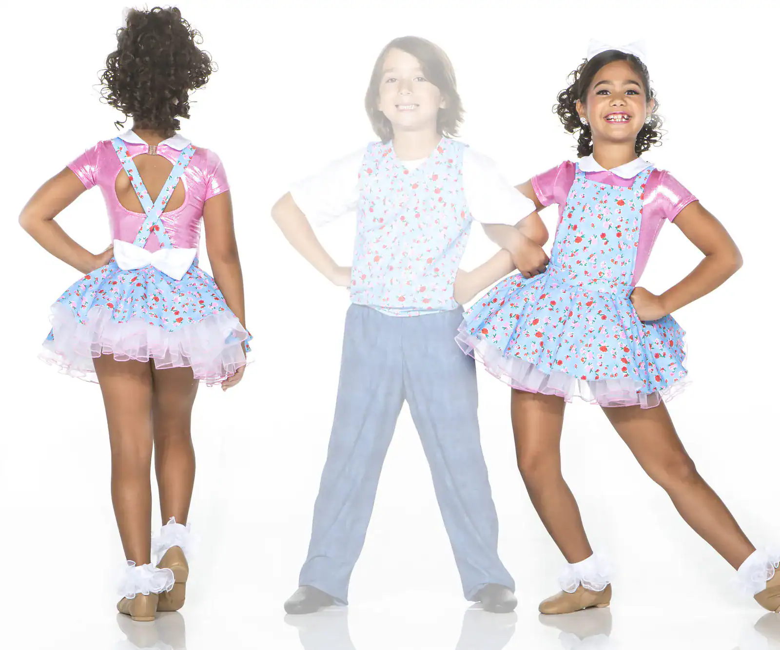 Children modeling floral dance costumes from front and back