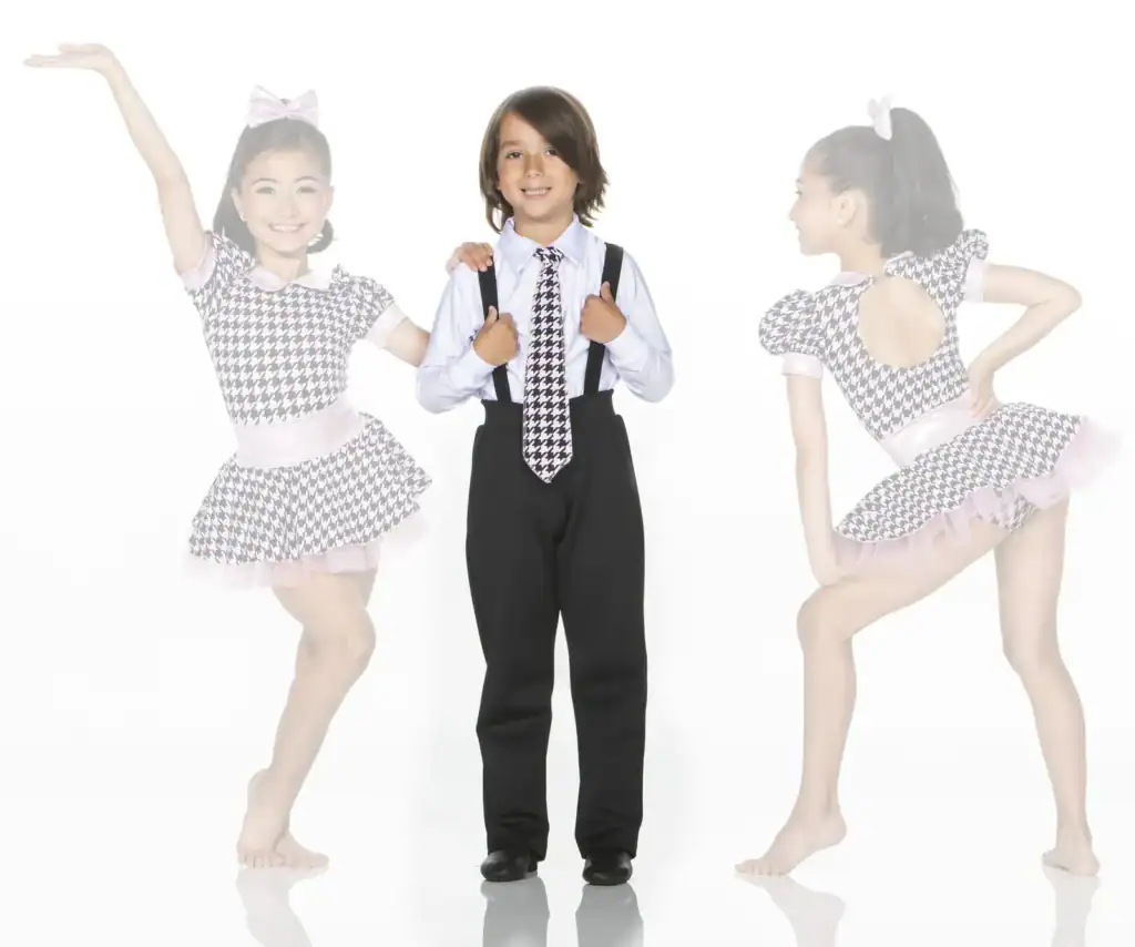 Young dancers in matching houndstooth costumes posing together
