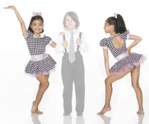 Young dancer modeling a houndstooth and pink costume