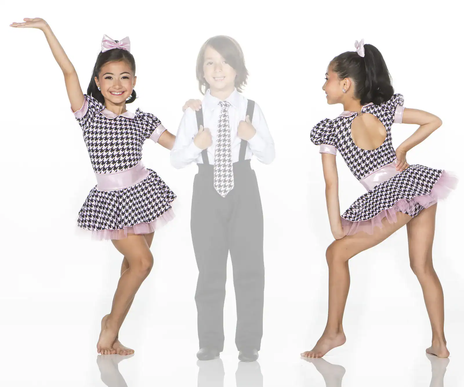 Young dancer modeling a houndstooth and pink costume