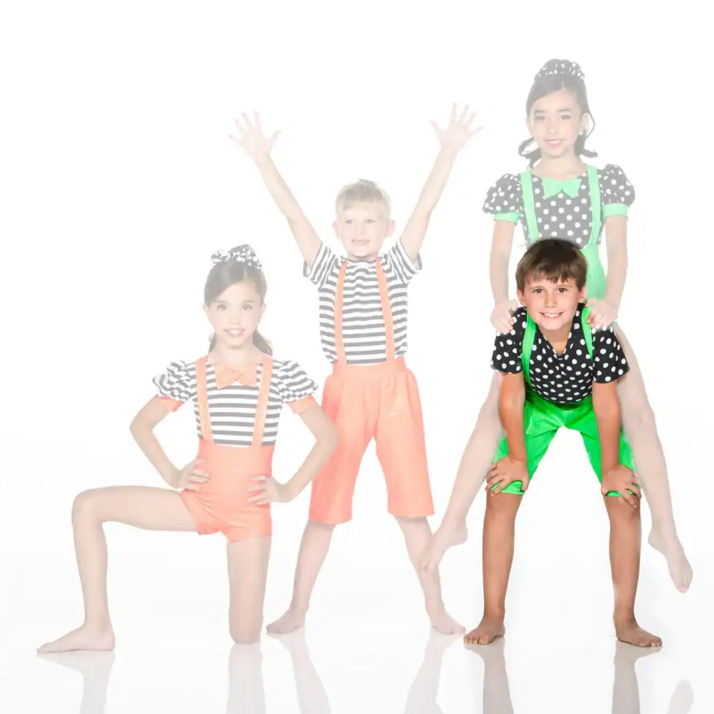Four children in colorful clown costumes posing together